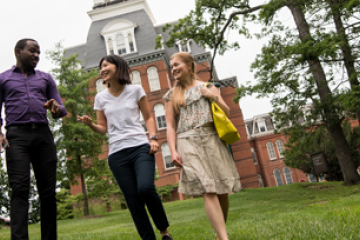 three eli students walking around campus