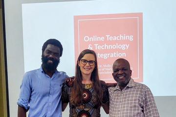 Molly Dunn stands between two professors from Malawi