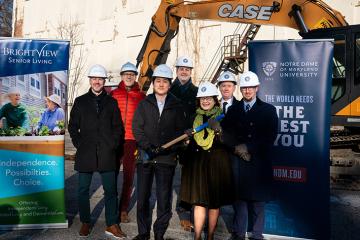 Group shot of NDMU and Brightview officials at demolition site