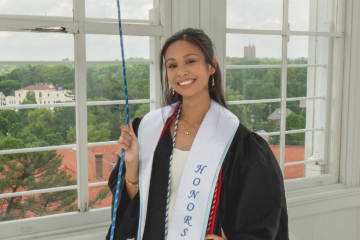 Sarah Generoso posing in graduation garb