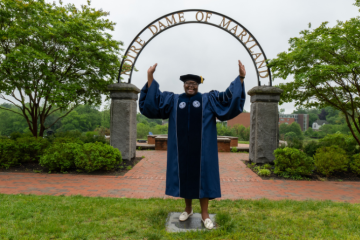 Lavorette Preston posing in front of NDMU archway