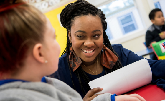Teacher working with student