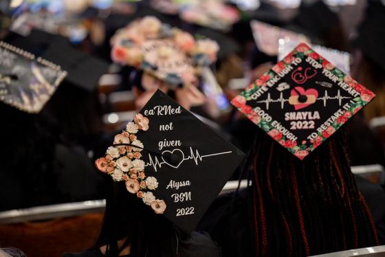 graduates with decorated caps