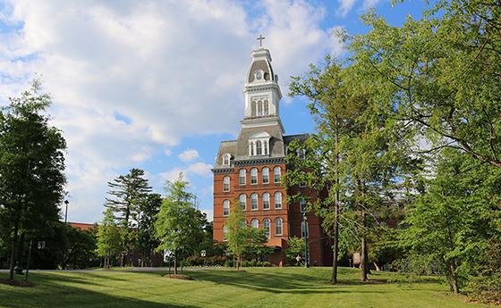 Caroline Hall pictured from the road leading up to campus.