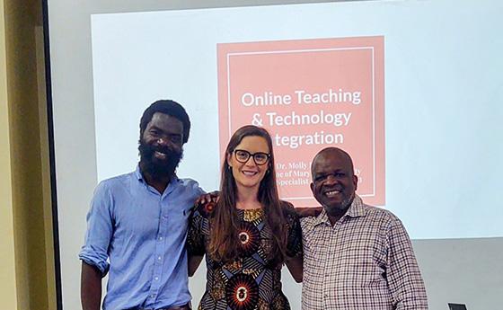 Molly Dunn stands between two professors from Malawi