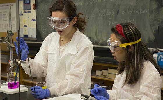 Two women work together in a lab