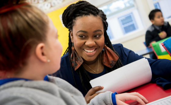 Teacher working with student