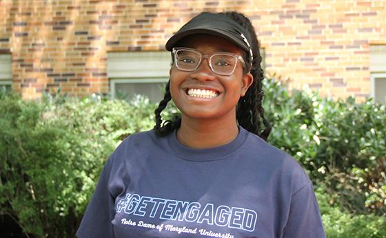 headshot of rochelle thompson in front of NDMU academic building