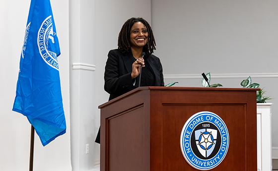 Tracy K. Smith stands at podium