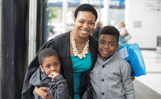 Mother on graduation day with her sons