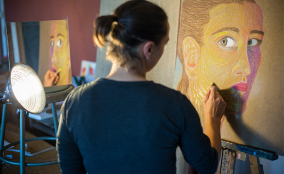 Student creating a self-portrait