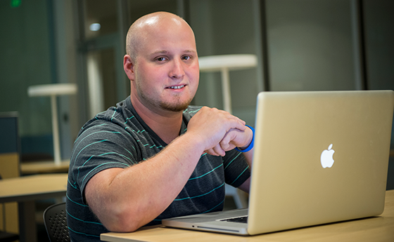 Man sitting with a laptop