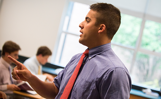 Male teacher leading a classroom