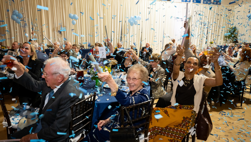 People throwing confetti in celebration