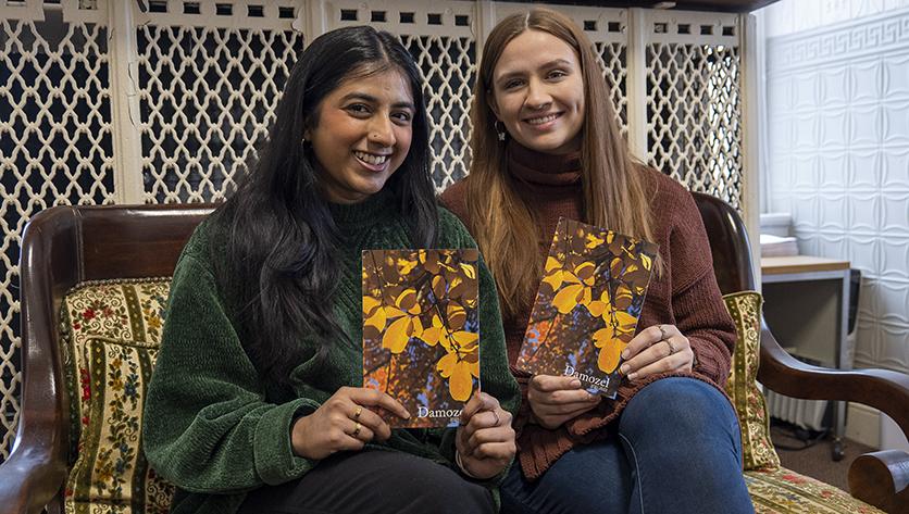Tahreem Haq and April Boss pose with the 2021-22 issue of Damozel