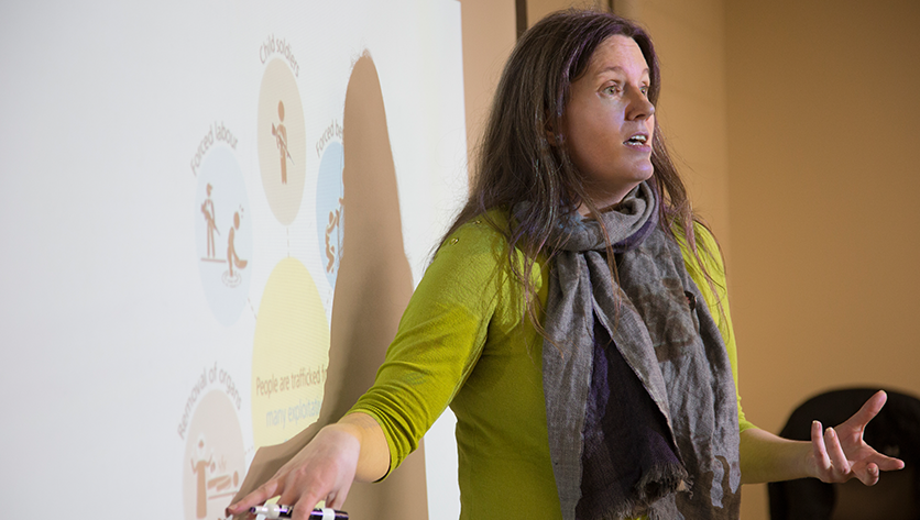 Jennifer Kerr teaching at a white board