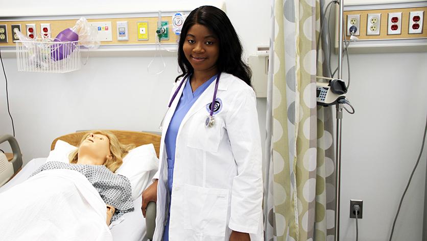 Sherry Nindow inside an NDMU nursing classroom