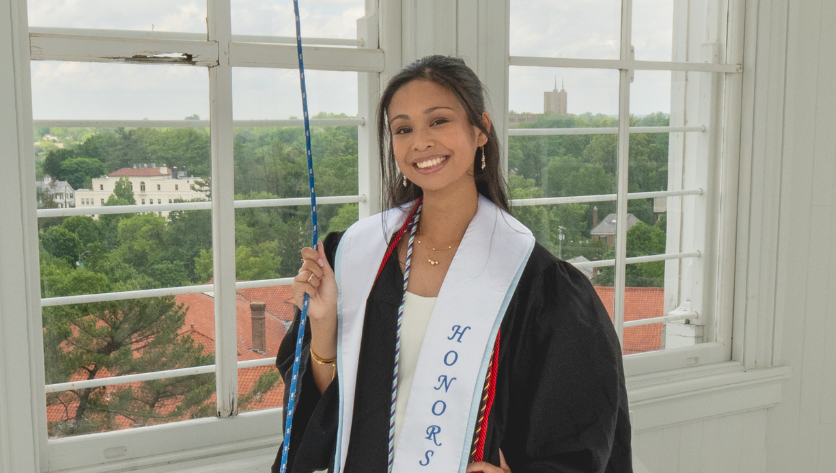 Sarah Generoso posing in graduation garb