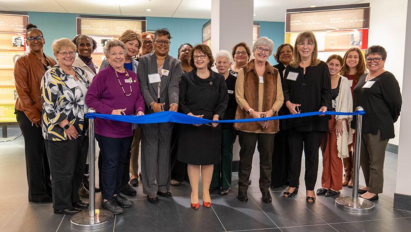 Representatives participating in the ribbon cutting