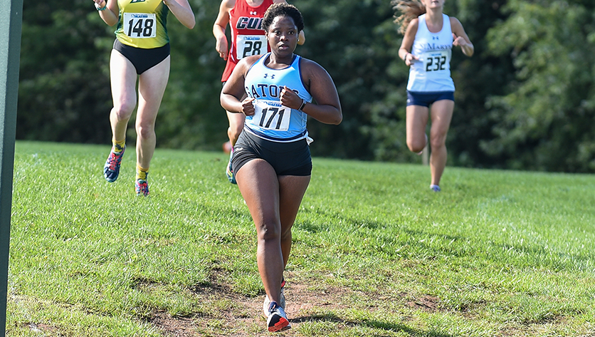 Tavia Williams runs in Cross Country race