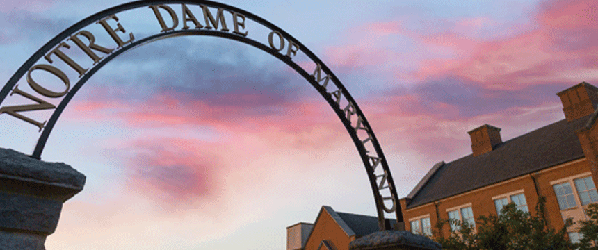 NDMU arch against the sunset