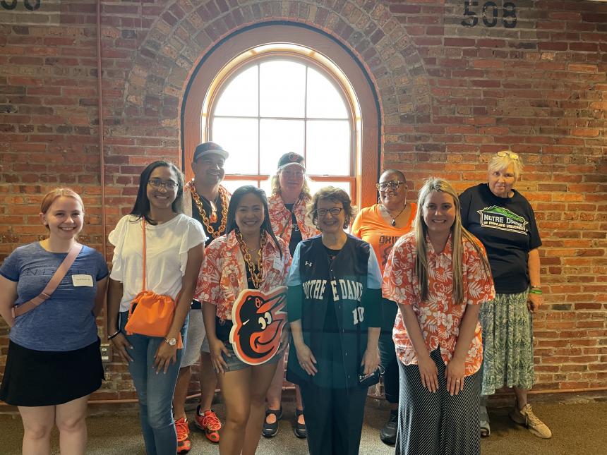 alumni and Dr. Yam at camden yards