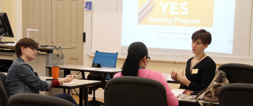 3 students sitting in a classroom learning about the yes program