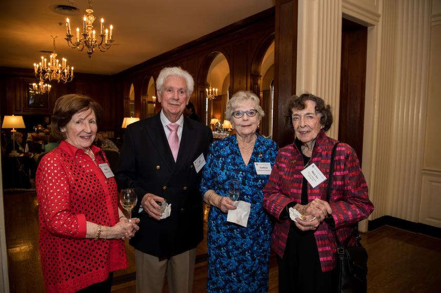 Four guests smile for the camera