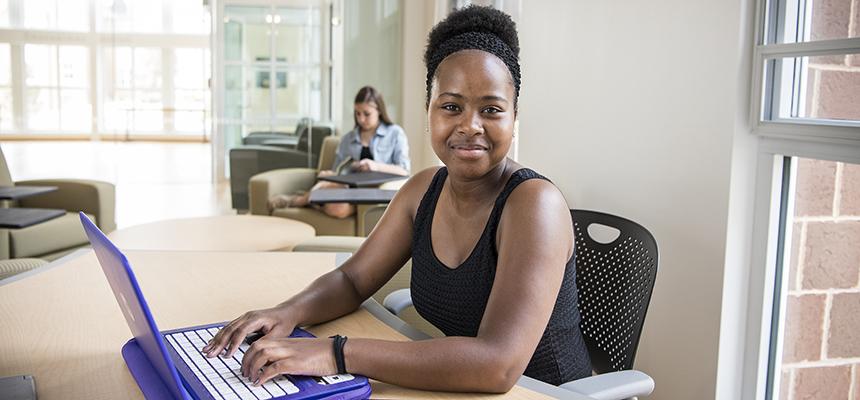 Female student working on a laptop