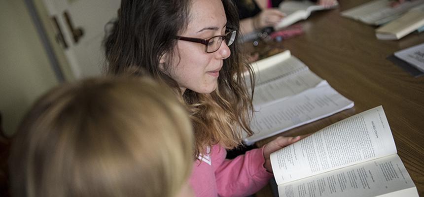 students reading a book