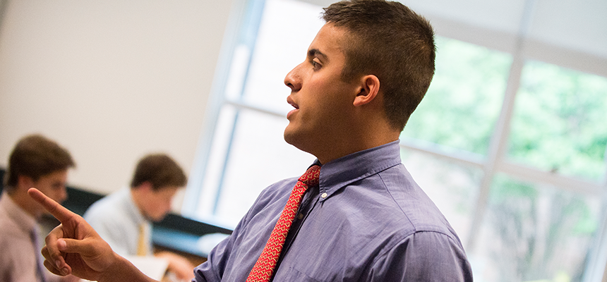 Male teacher instructing a class