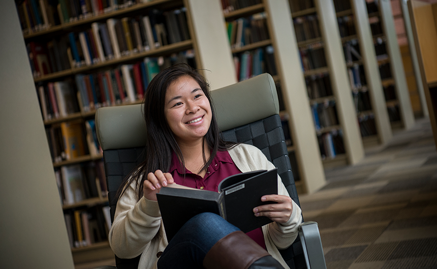 Student reading in the library