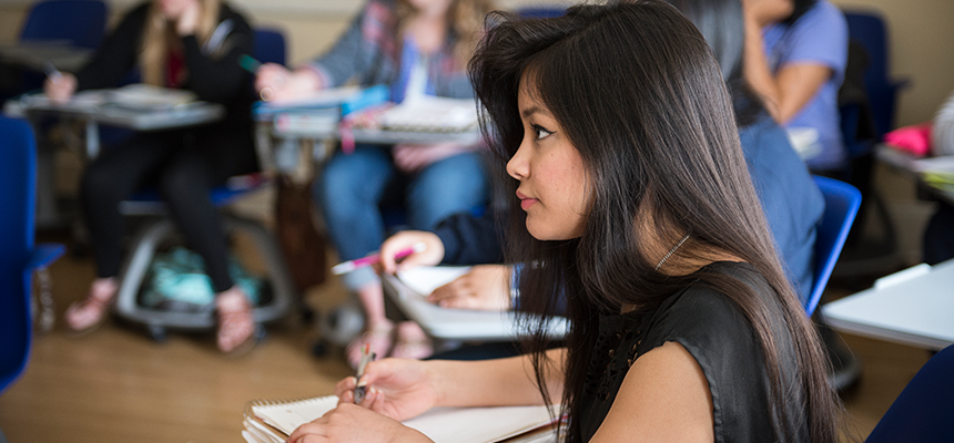 female students listening in classroom