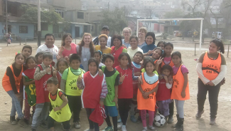 V Cox with students in Peru