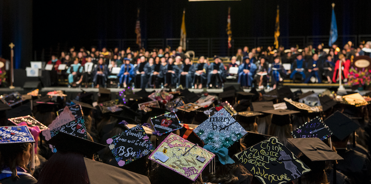 NDMU graduation, crowd of students with graduation caps