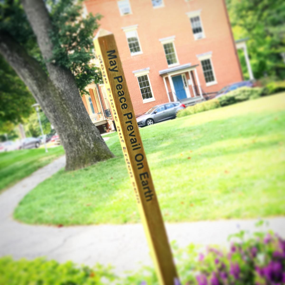 Wide shot of the peace pole